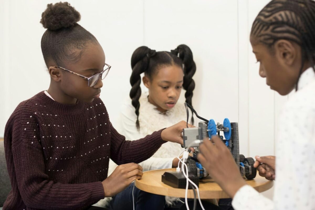 two girls are working on a project together