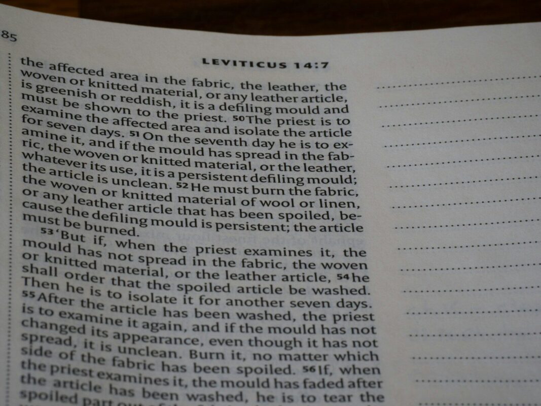 Bible text from leviticus 14:7 on a page.