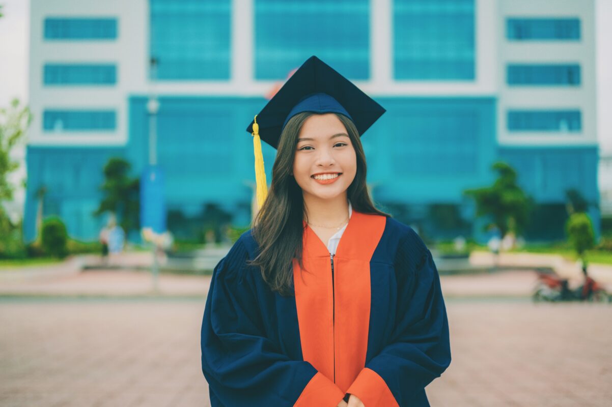 A Nigerian student standing on a pathway made of stepping stones labeled strong statement of purpose, quality recommendations, relevant work history, and leadership experience, leading toward a fully funded international scholarship scroll. This illustrates how to win scholarships without a first class degree, brought to you by Clacachi Edu Limited, a top study abroad agency in Abuja, Nigeria.